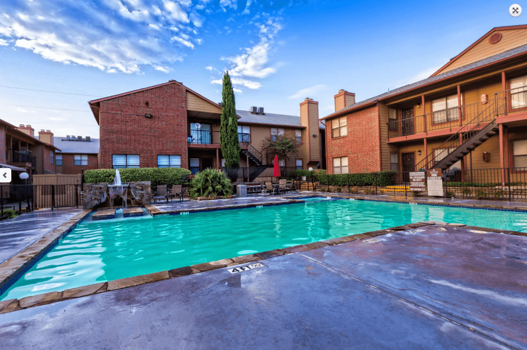 A pool with a view of the building.