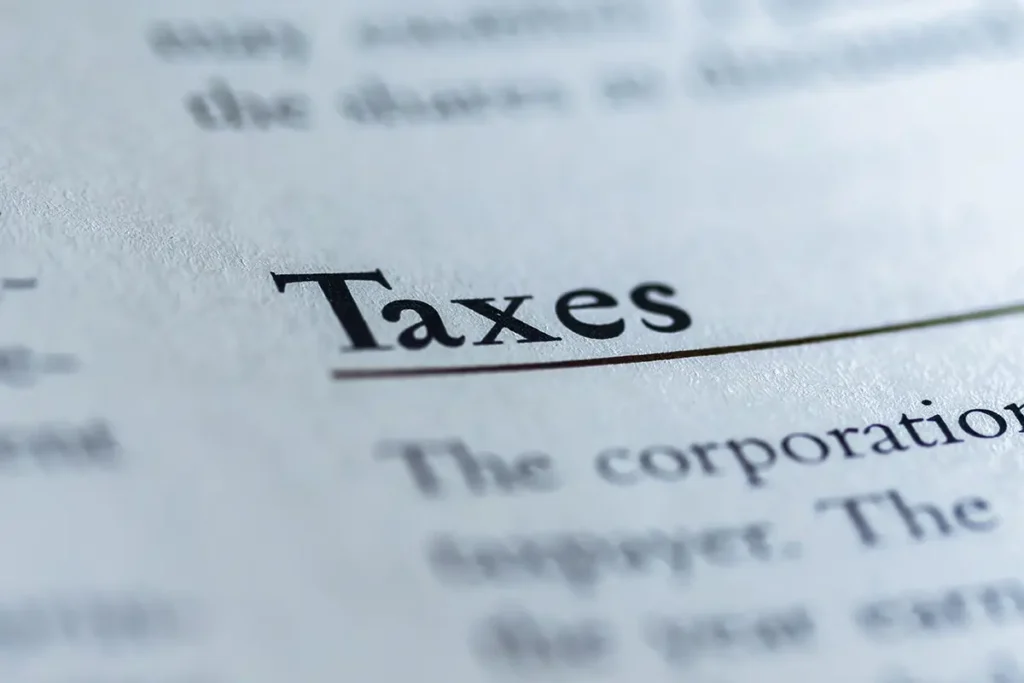 A close up of the word taxes on top of a page.