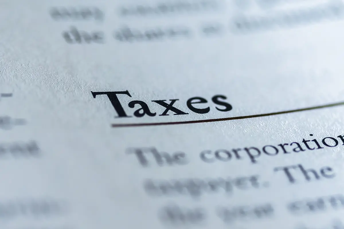 A close up of the word taxes on top of a page.